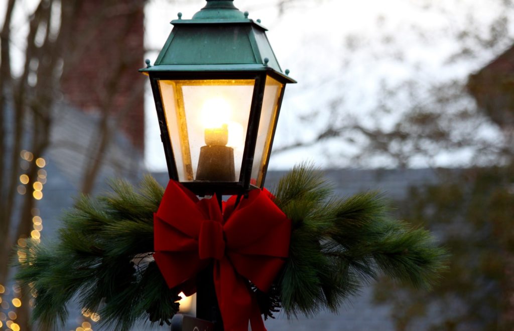 A lamppost with a red bow.