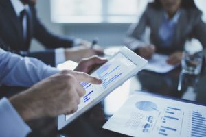 professionals discussing market data